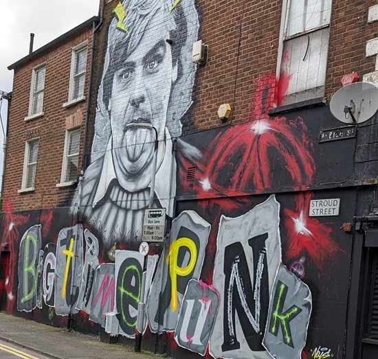 The legacy of the "Godfather of Belfast punk", Terri Hooley, has been celebrated with a new mural in the heart of his native city.